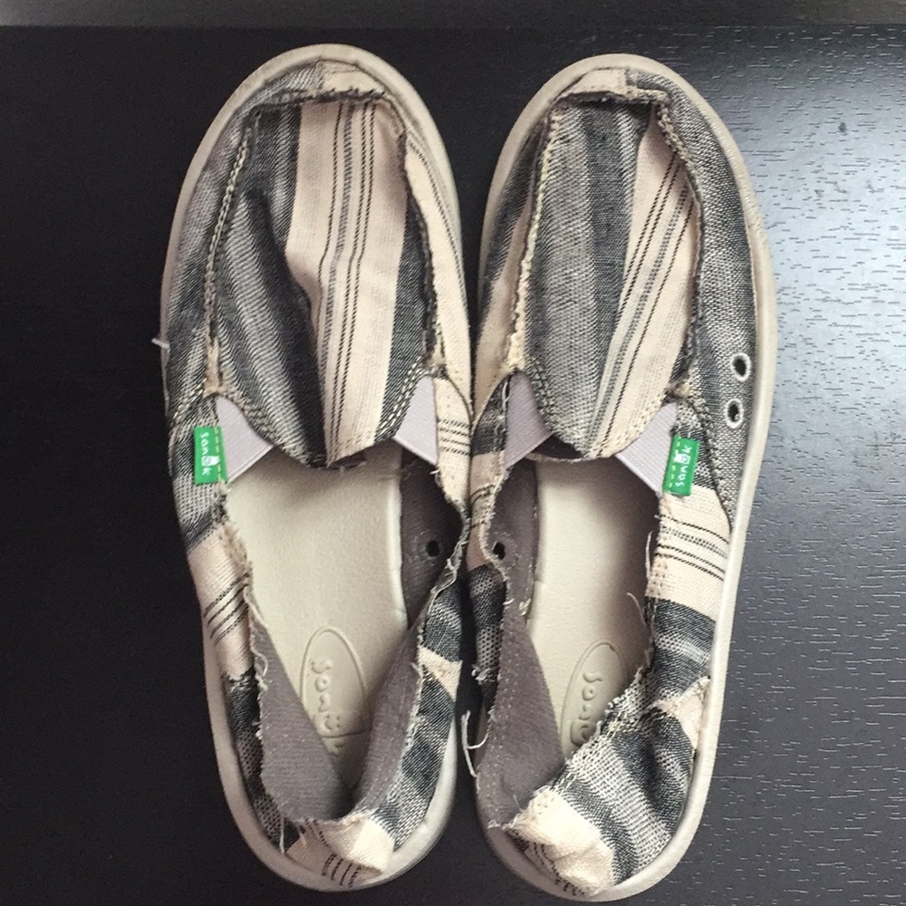 Grey, black, and white stripped Sanuks
